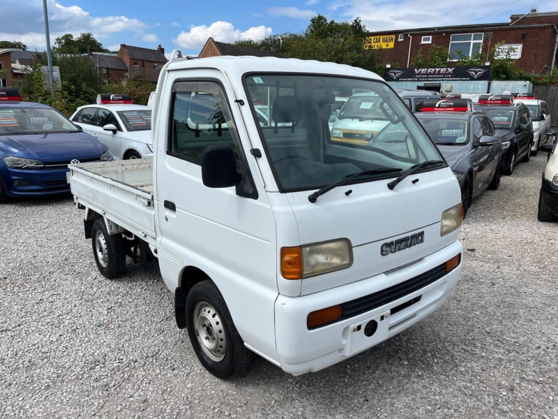 1996 Suzuki Carry Dropside 0.7 4WD Kei Pick Up Truck in White — image 1